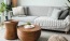 Bright room with large sofa, plants, and wood